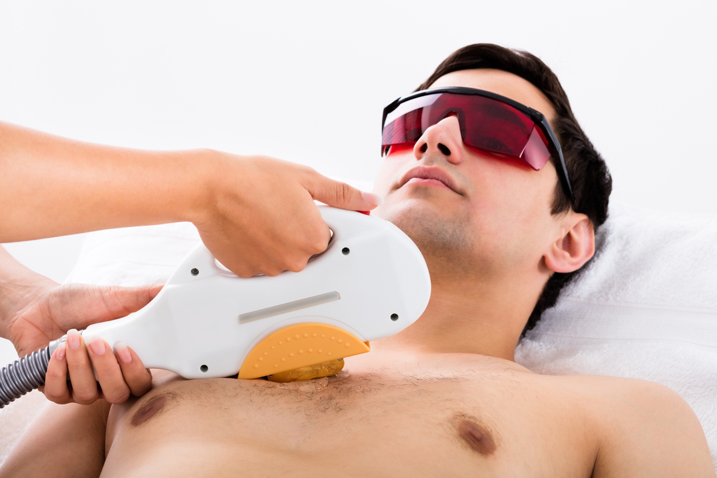 Man receiving laser hair treatment